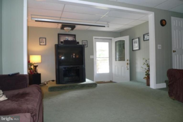 1822 Forrest Road Parkville, MD 21234 - Photo 9 of 21 a living room with furniture and a fireplace