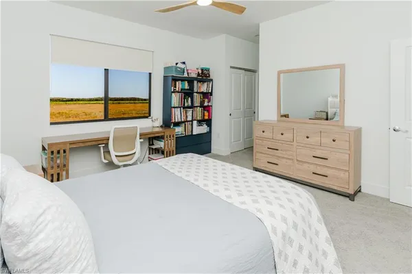a bedroom with a bed and furniture