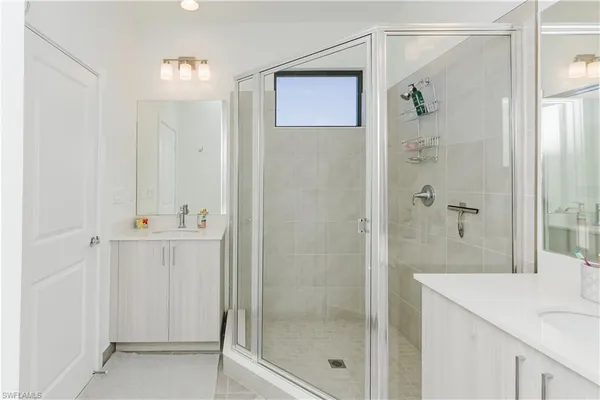 a bathroom with a shower and a sink