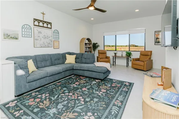 a living room with furniture and a rug