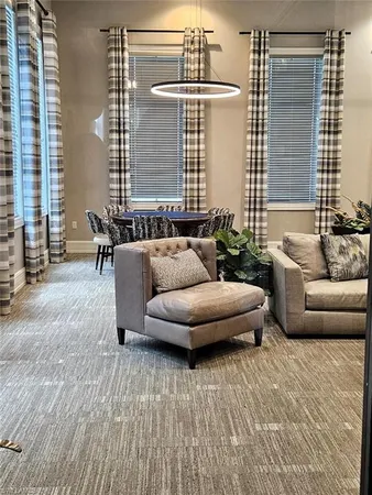 a living room with furniture and windows