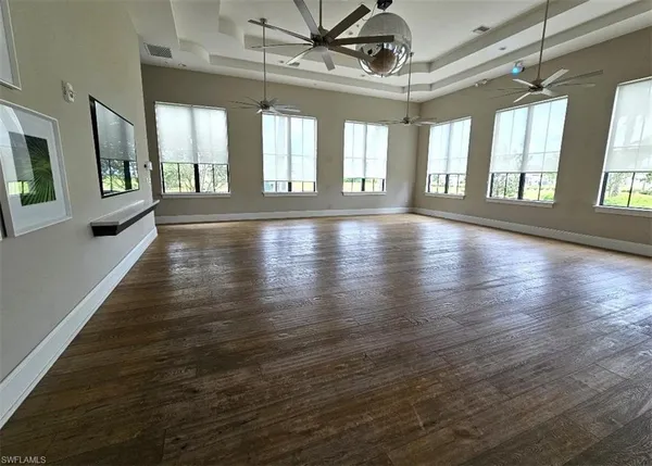 a living room filled with furniture and a flat screen tv