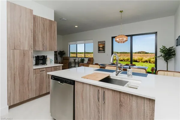 a kitchen with counter top space a sink and cabinets