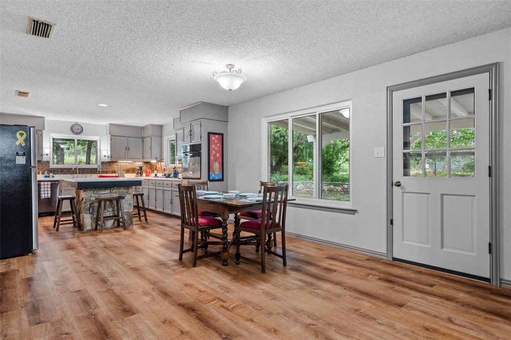 a view of a dining room with furniture and window
