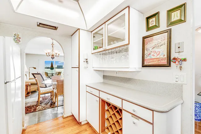 a kitchen with stainless steel appliances a stove a refrigerator and cabinets