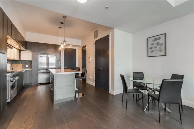a view of a dining room with furniture and wooden floor