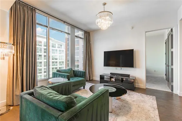 a living room with furniture and a flat screen tv