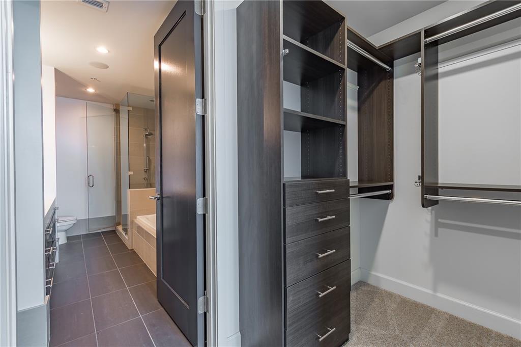 1820 Peachtree Road Northwest, Unit 1111 Atlanta, GA 30309 - Photo 16 of 41 a view of a hallway with closet and wooden floor