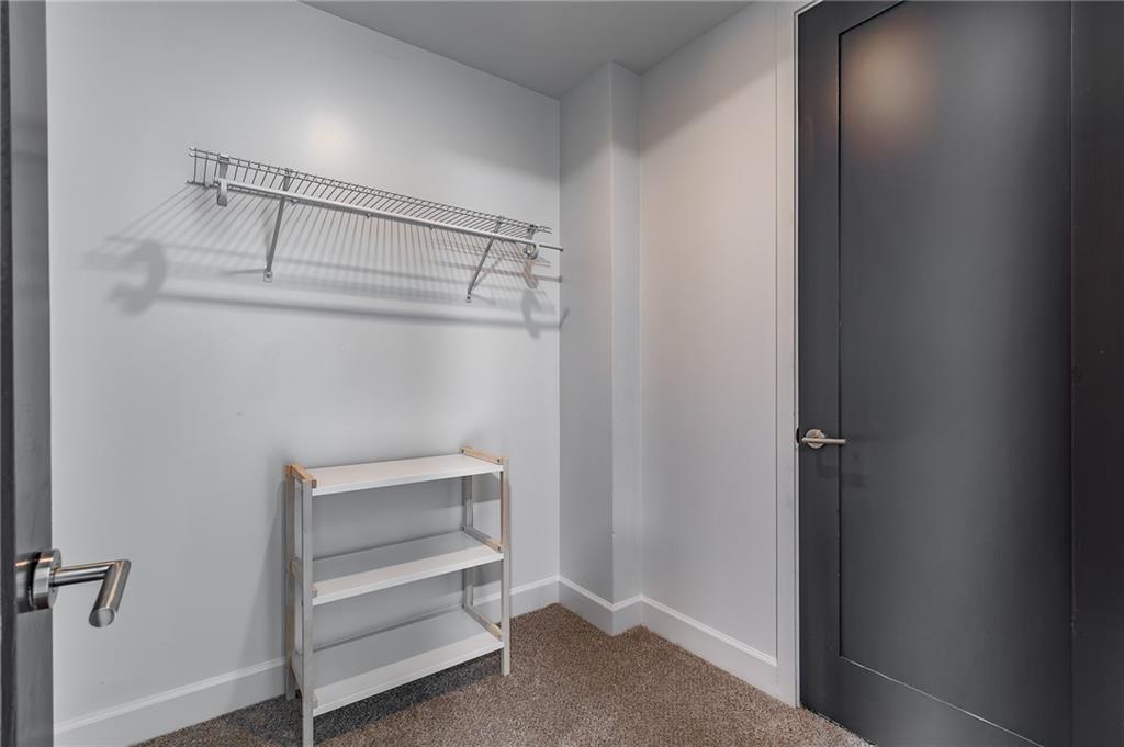 1820 Peachtree Road Northwest, Unit 1111 Atlanta, GA 30309 - Photo 27 of 41 a view of an empty walk in closet