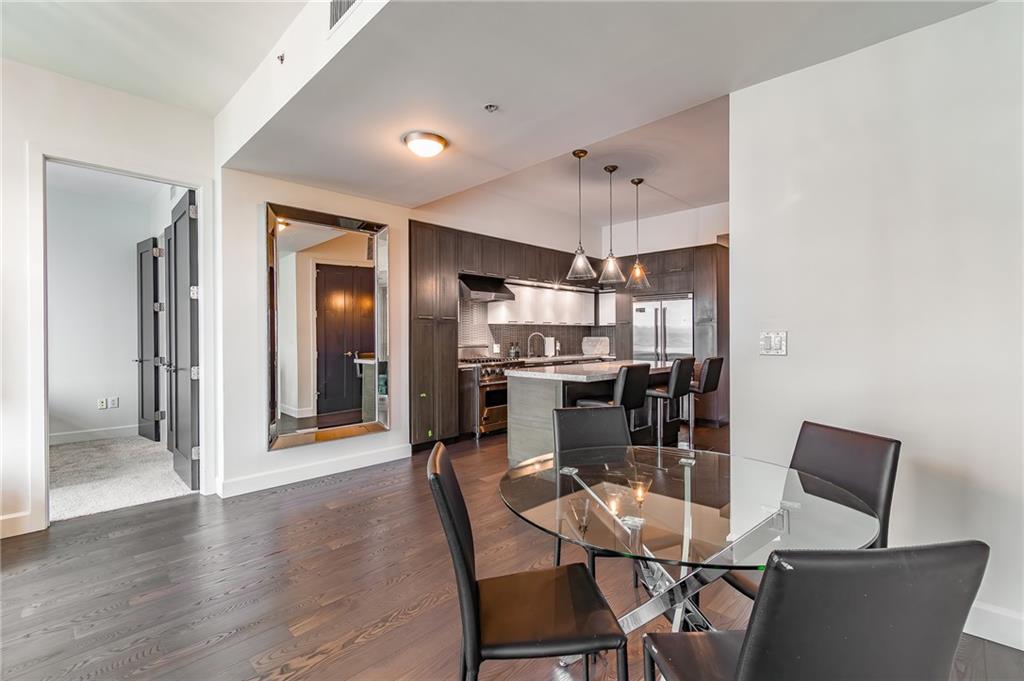 1820 Peachtree Road Northwest, Unit 1111 Atlanta, GA 30309 - Photo 28 of 41 a dining room with furniture and window