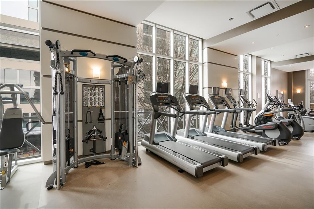 1820 Peachtree Road Northwest, Unit 1111 Atlanta, GA 30309 - Photo 32 of 41 a view of a room with gym equipment