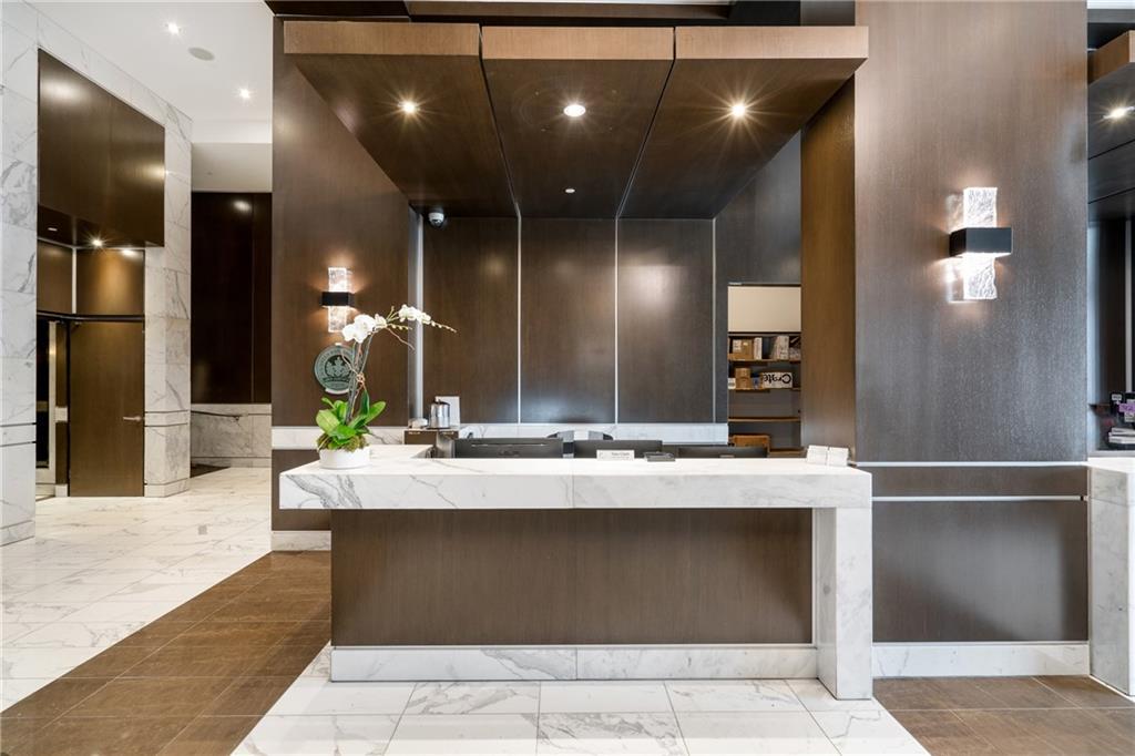 1820 Peachtree Road Northwest, Unit 1111 Atlanta, GA 30309 - Photo 35 of 41 a view of a lobby with black carpet