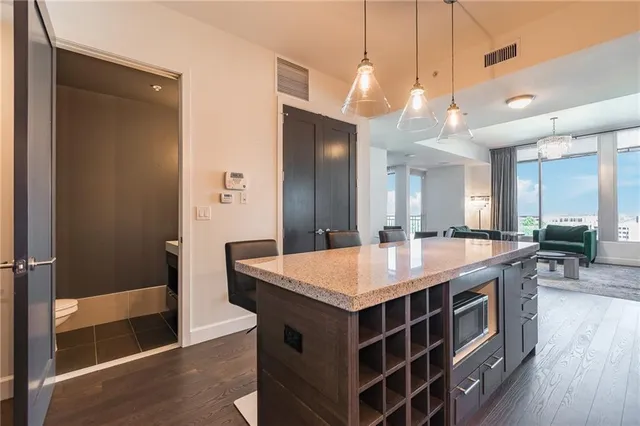 a large kitchen with a table and chairs