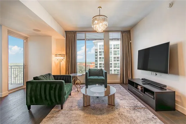 a living room with furniture and a flat screen tv