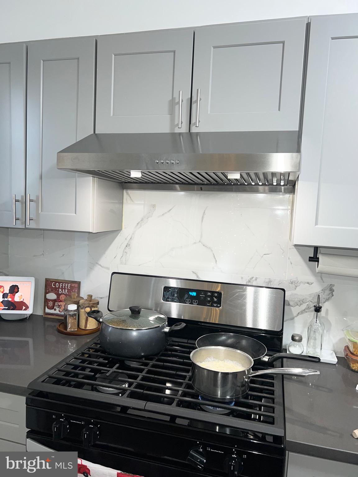 3019 St Vincent Street Philadelphia, PA 19149 - Photo 12 of 33 a stove top oven sitting inside of a kitchen