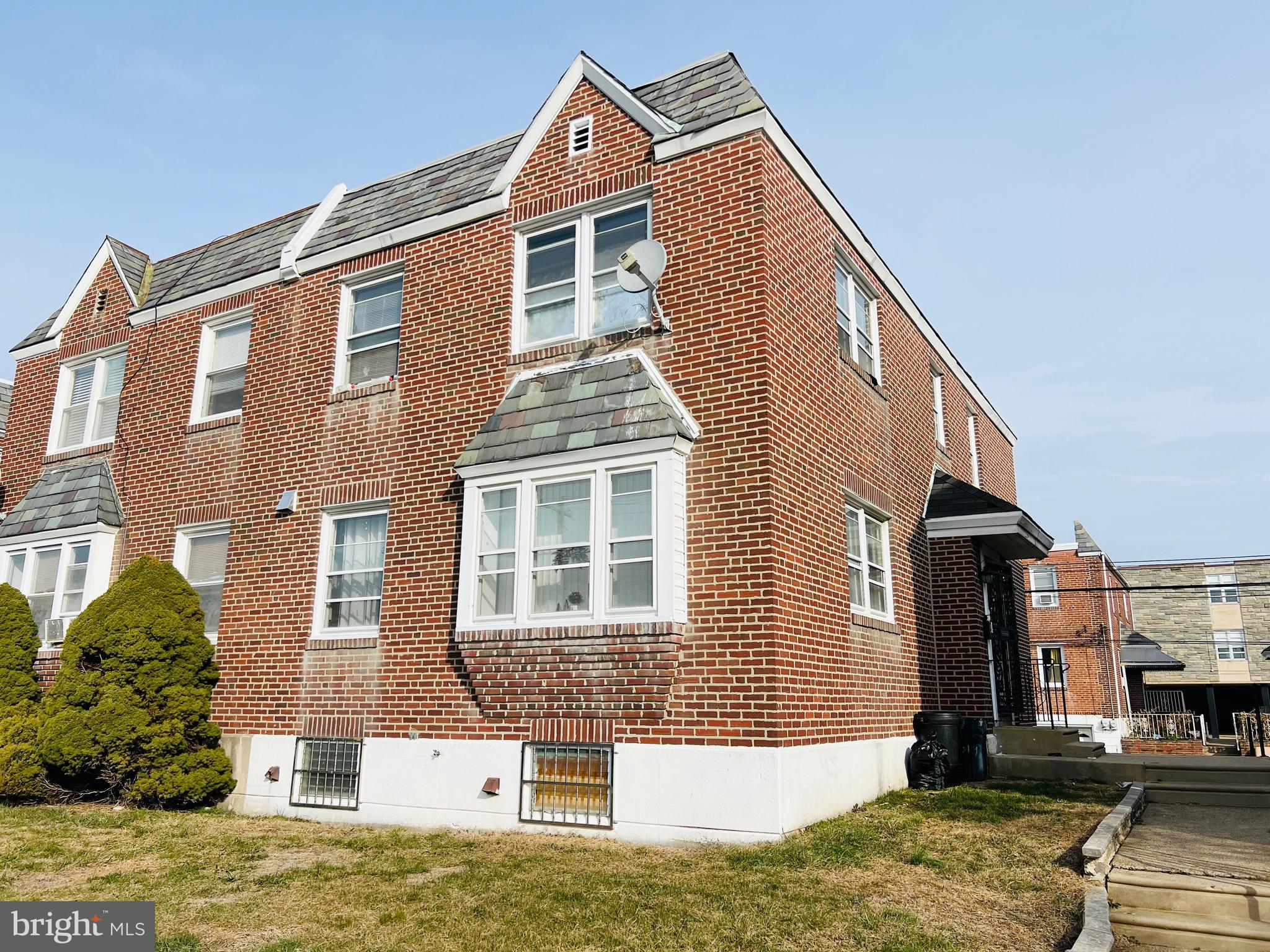 3019 St Vincent Street Philadelphia, PA 19149 - Photo 4 of 33 a front view of a house with a yard