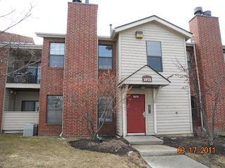 1975 North Hicks Road, Unit 107 Palatine, IL 60074 - Photo 1 of 1 a small white house with a outdoor space