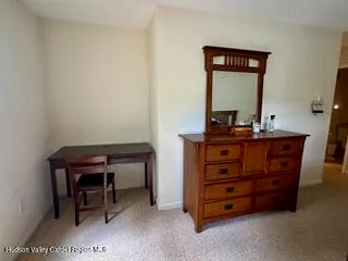 a room with a table and a mirror