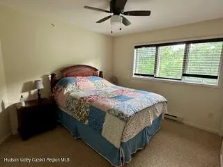 a bedroom with a bed and window