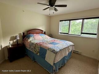 274 Brooksburgh Road, Unit 48 Hensonville, NY 12439 - Photo 18 of 30 a bedroom with a bed and window