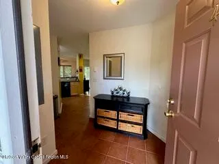 a hallway with a table and a mirror