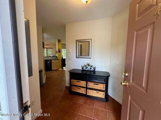274 Brooksburgh Road, Unit 48 Hensonville, NY 12439 - Photo 2 of 30 a hallway with a table and a mirror