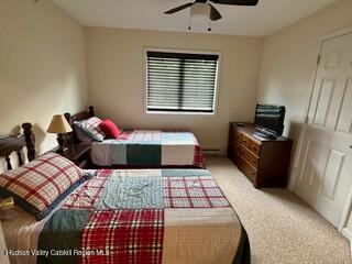 274 Brooksburgh Road, Unit 48 Hensonville, NY 12439 - Photo 21 of 30 a bedroom with a bed and wooden floor