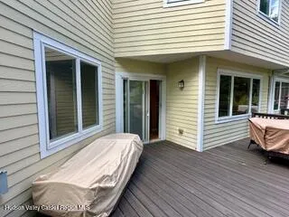 a white roof sitting in front of house