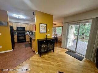 274 Brooksburgh Road, Unit 48 Hensonville, NY 12439 - Photo 5 of 30 a kitchen with stainless steel appliances granite countertop a refrigerator and a stove