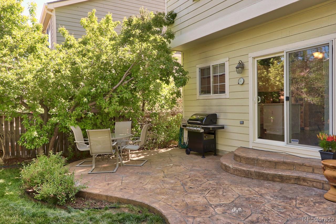 9818 Mulberry Way Highlands Ranch, CO 80129 - Photo 26 of 34 a view of a patio with table and chairs and potted plants