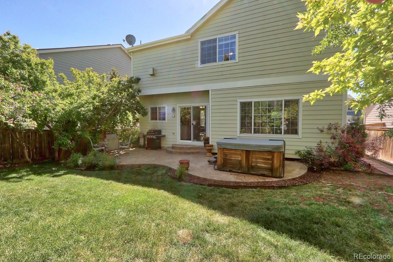 9818 Mulberry Way Highlands Ranch, CO 80129 - Photo 28 of 34 a view of a house with backyard and sitting area