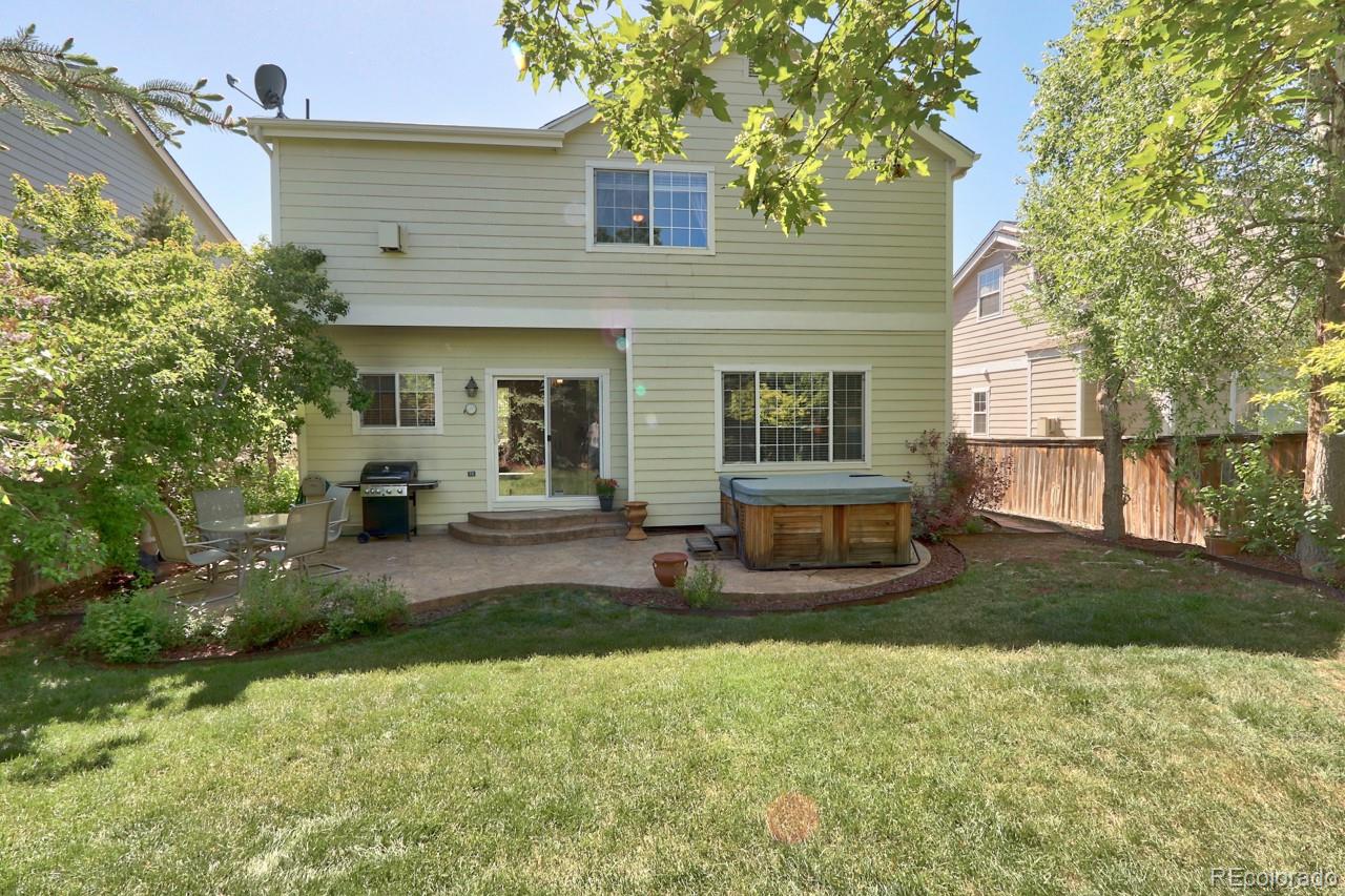 9818 Mulberry Way Highlands Ranch, CO 80129 - Photo 29 of 34 a view of a house with backyard and sitting area