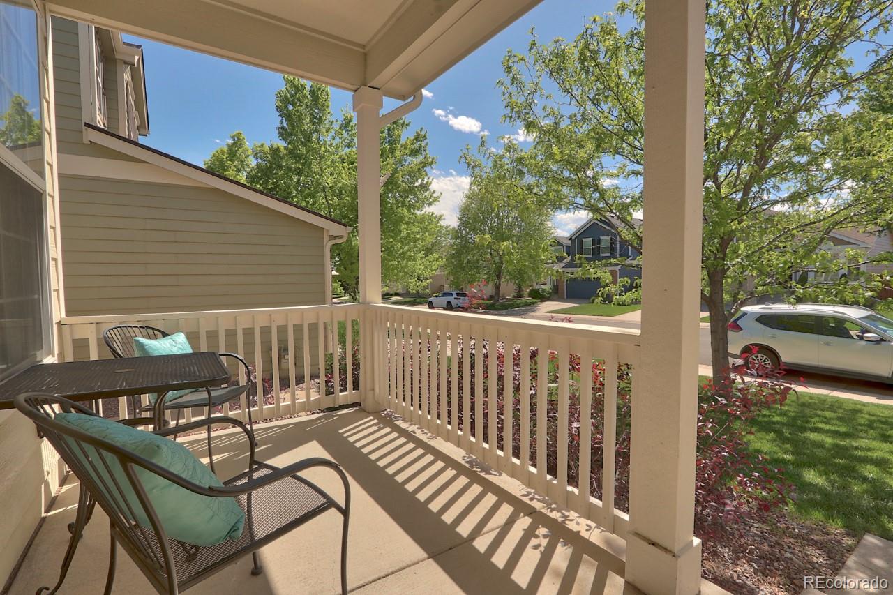 9818 Mulberry Way Highlands Ranch, CO 80129 - Photo 30 of 34 a view of a chair and tables front of the house