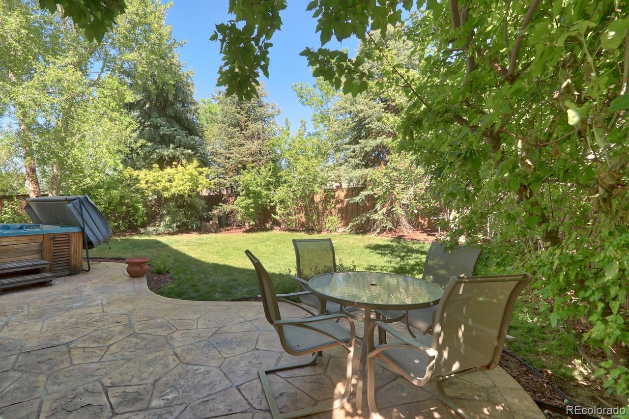 9818 Mulberry Way Highlands Ranch, CO 80129 - Photo 34 of 34 a view of a chairs and table in the patio