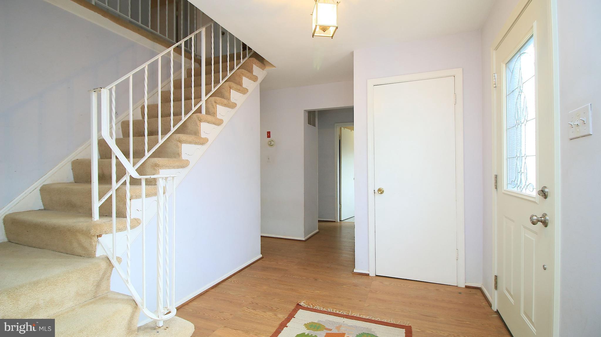 9709 Rhapsody Drive Vienna, VA 22180 - Photo 13 of 26 WINDING STAIRCASE TO UPPER LEVEL