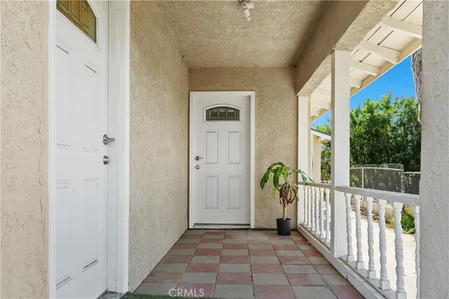 a view of a porch with wooden floor