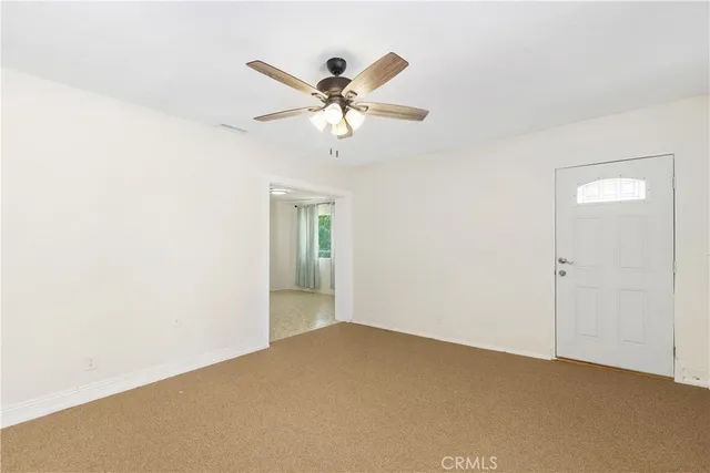 a view of a big room with carpet