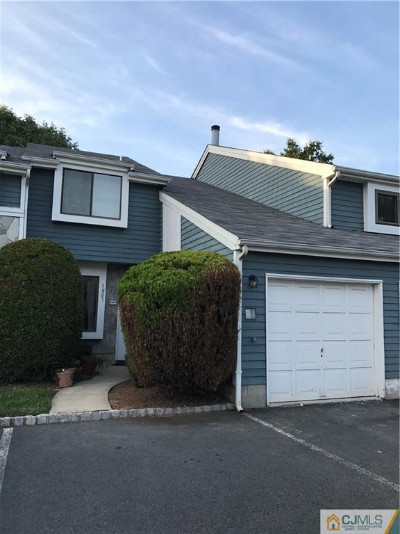 5807 Hana Road Edison, NJ 08817 - Photo 1 of 8 a front view of a house with a yard and garage