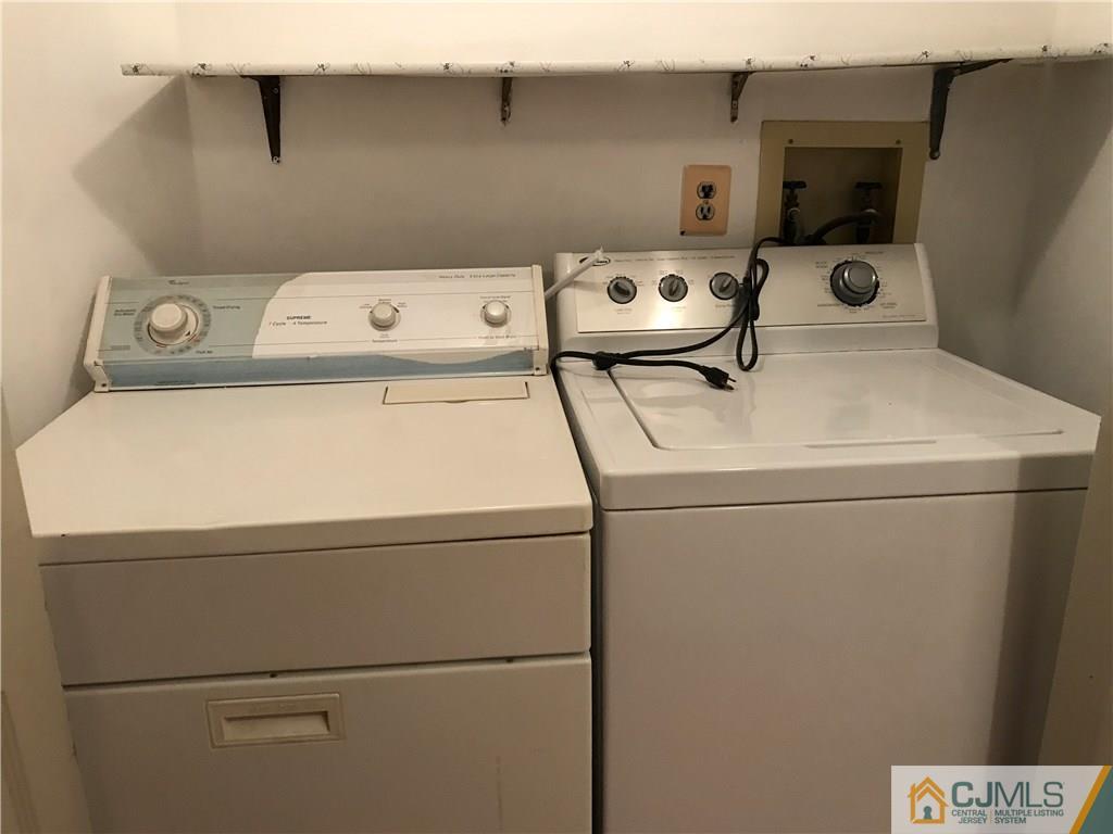 5807 Hana Road Edison, NJ 08817 - Photo 8 of 8 a utility room with dryer and washer