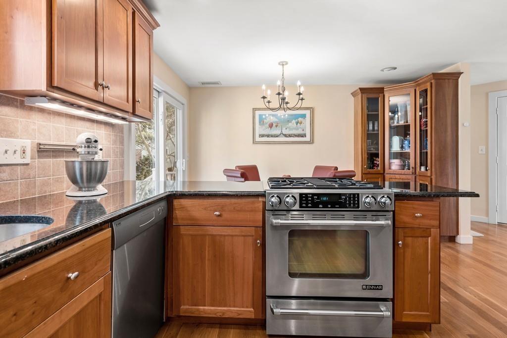 14 Ridge Hill Road Sudbury, MA 01776 - Photo 14 of 34 a kitchen with stainless steel appliances granite countertop a stove and a sink