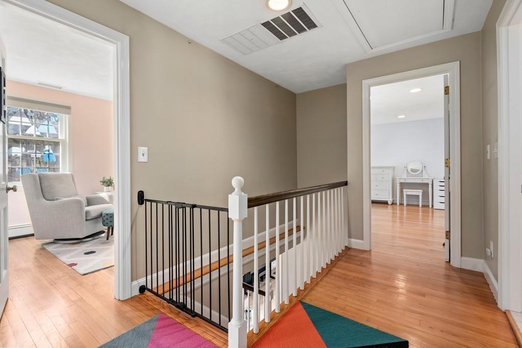 14 Ridge Hill Road Sudbury, MA 01776 - Photo 18 of 34 a view of a hallway with wooden floor and furniture