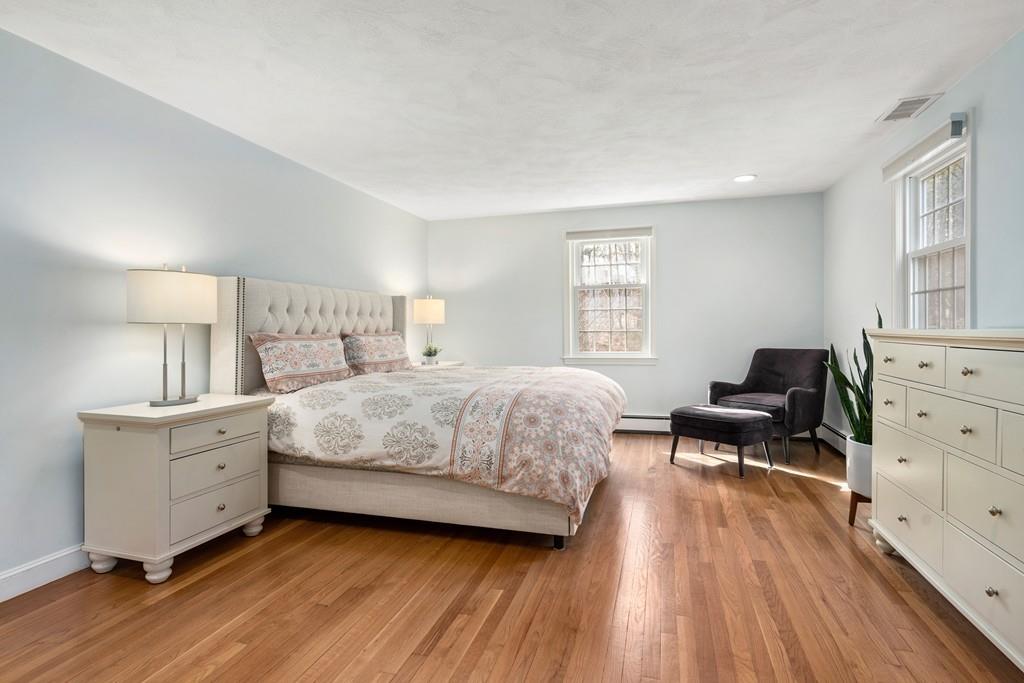 14 Ridge Hill Road Sudbury, MA 01776 - Photo 19 of 34 a bedroom with a bed and wooden floor