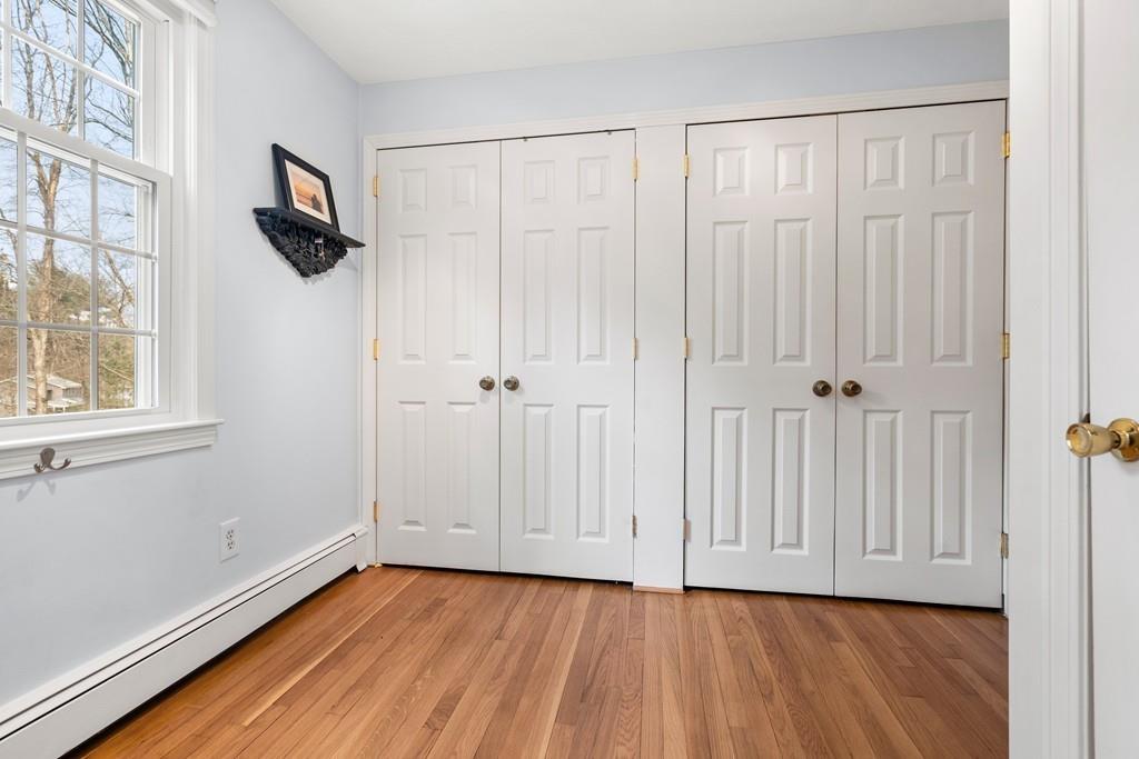 14 Ridge Hill Road Sudbury, MA 01776 - Photo 21 of 34 a view of an empty room with wooden floor and a window