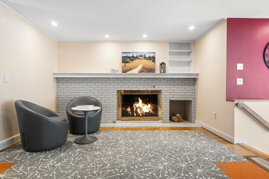 14 Ridge Hill Road Sudbury, MA 01776 - Photo 6 of 34 a living room with furniture a fireplace and a rug