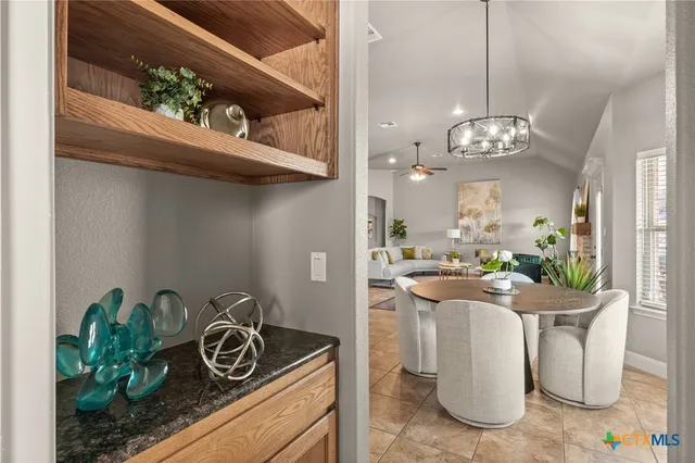 a kitchen with stainless steel appliances granite countertop a sink and a stove