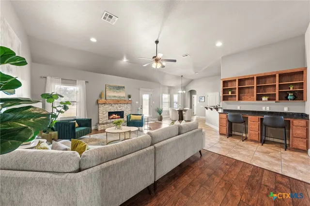 a living room with furniture and a fireplace