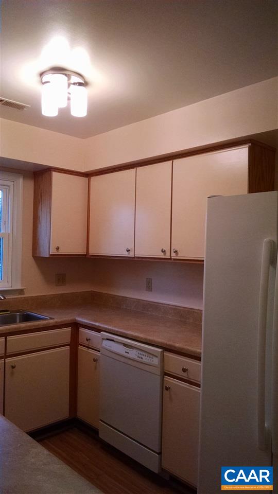 699 Carnation Road Ruckersville, VA 22968 - Photo 11 of 40 a kitchen with cabinets and white appliances