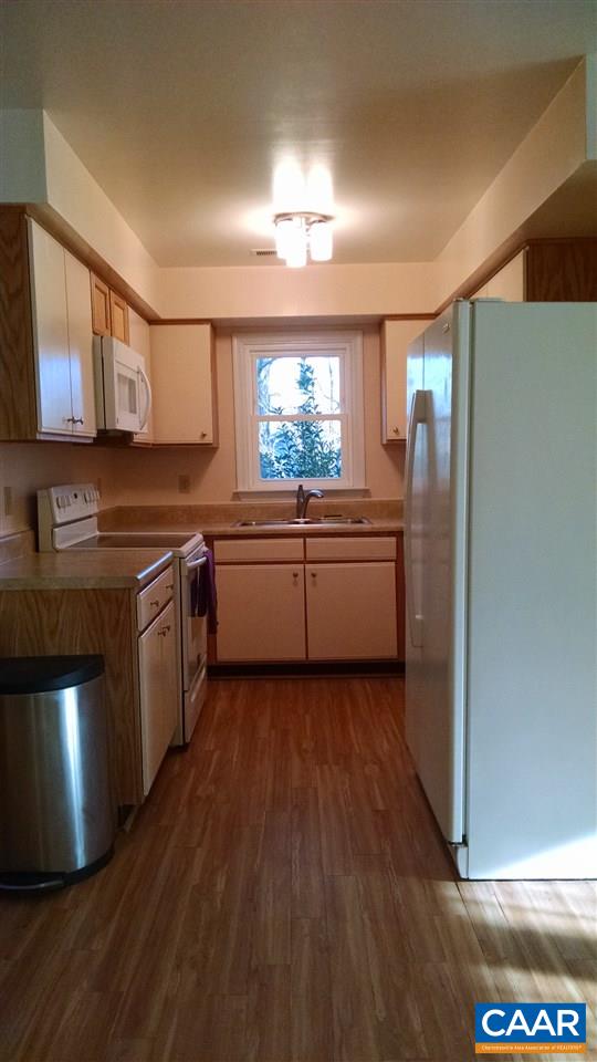 699 Carnation Road Ruckersville, VA 22968 - Photo 12 of 40 a kitchen with stainless steel appliances granite countertop a stove a sink and a refrigerator