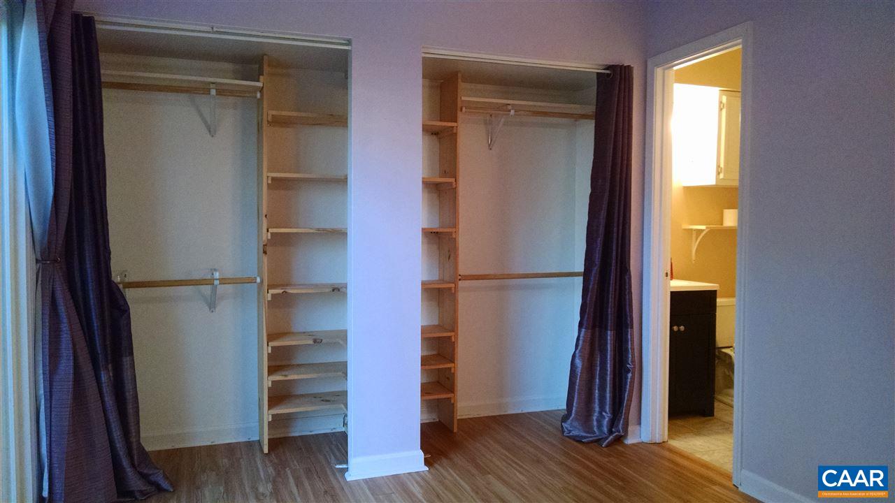 699 Carnation Road Ruckersville, VA 22968 - Photo 18 of 40 a view of a bedroom with wooden floor and closet