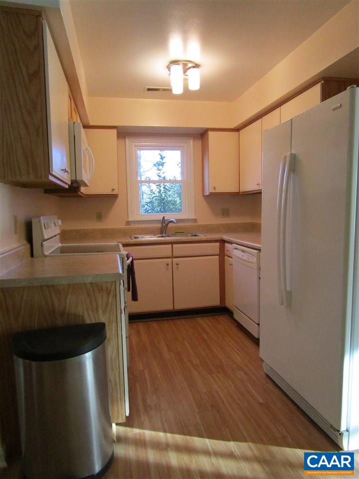 699 Carnation Road Ruckersville, VA 22968 - Photo 21 of 40 a kitchen with stainless steel appliances a sink a stove a refrigerator and cabinets